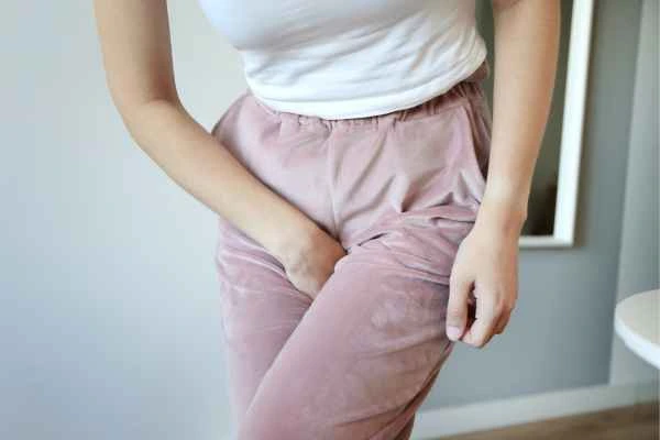 woman running for the toilet because of urinary incontinence Bricket Wood